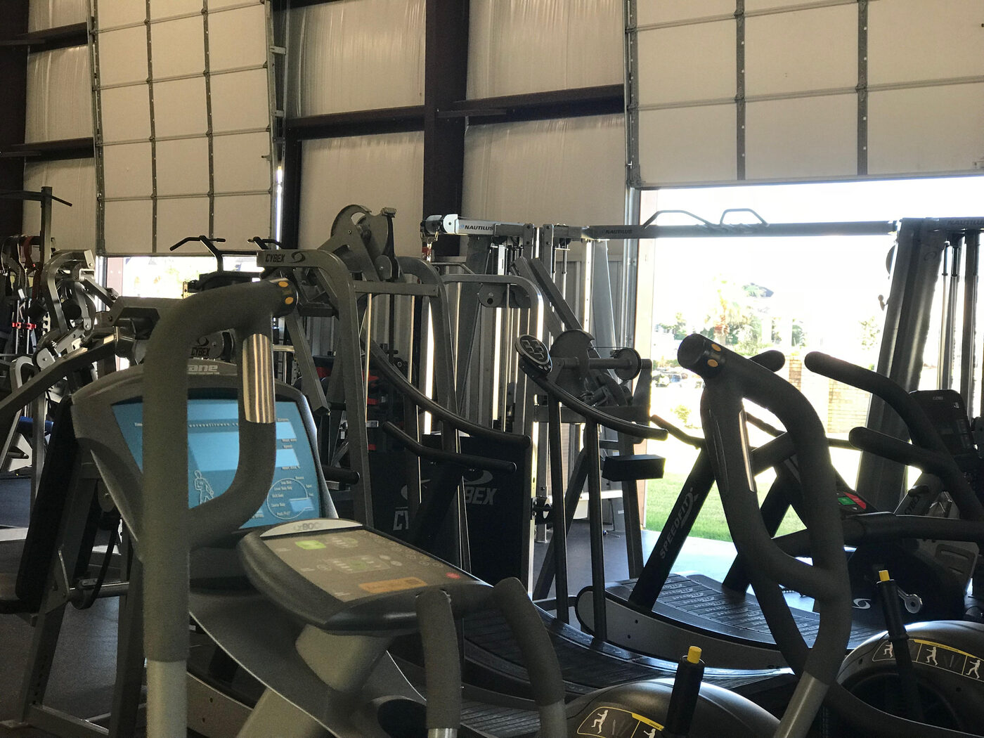 Nautilus and Cybex machines beside the open bay doors