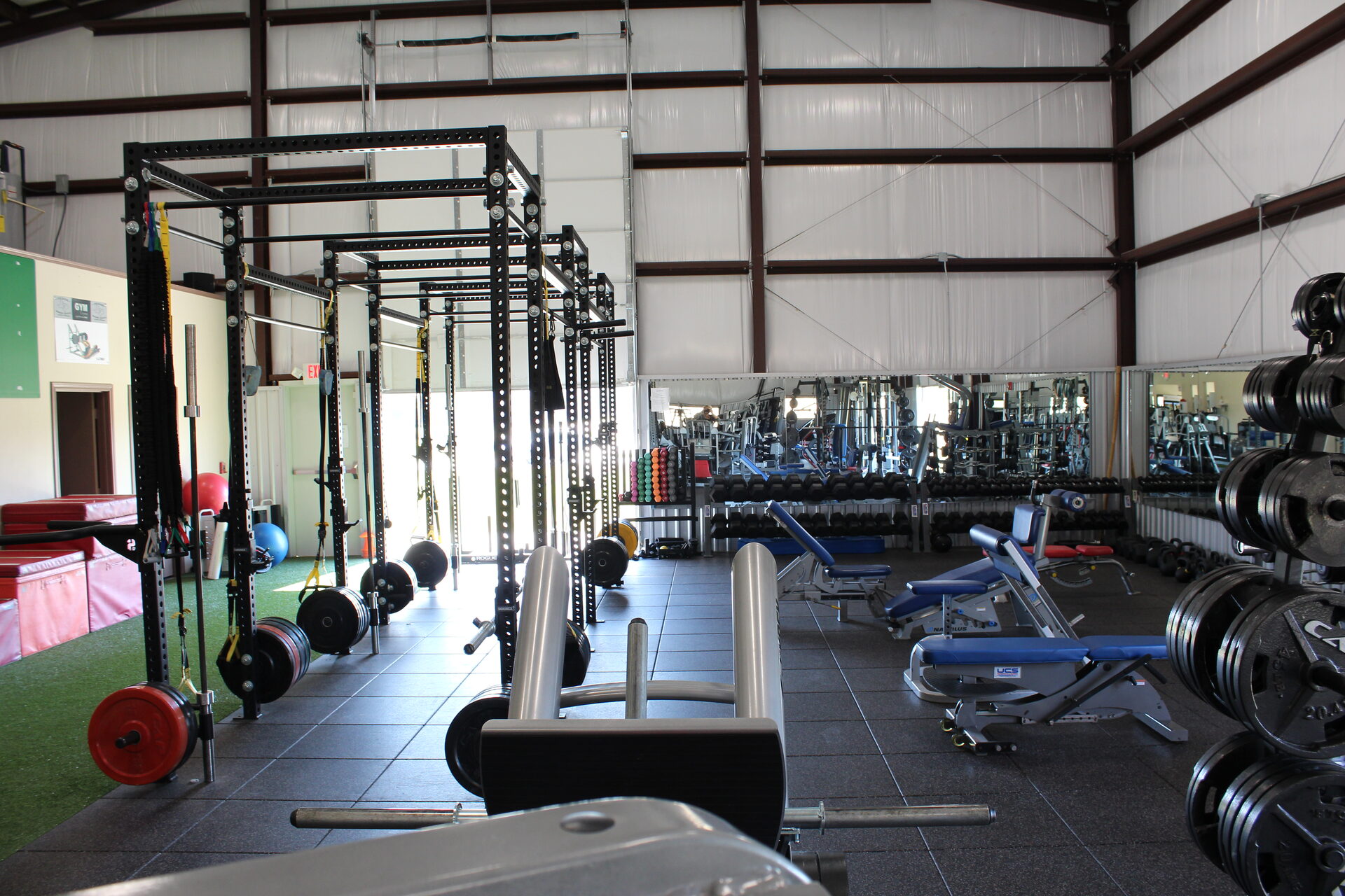 Gym Cypress training floor with the roll-up bay doors open
