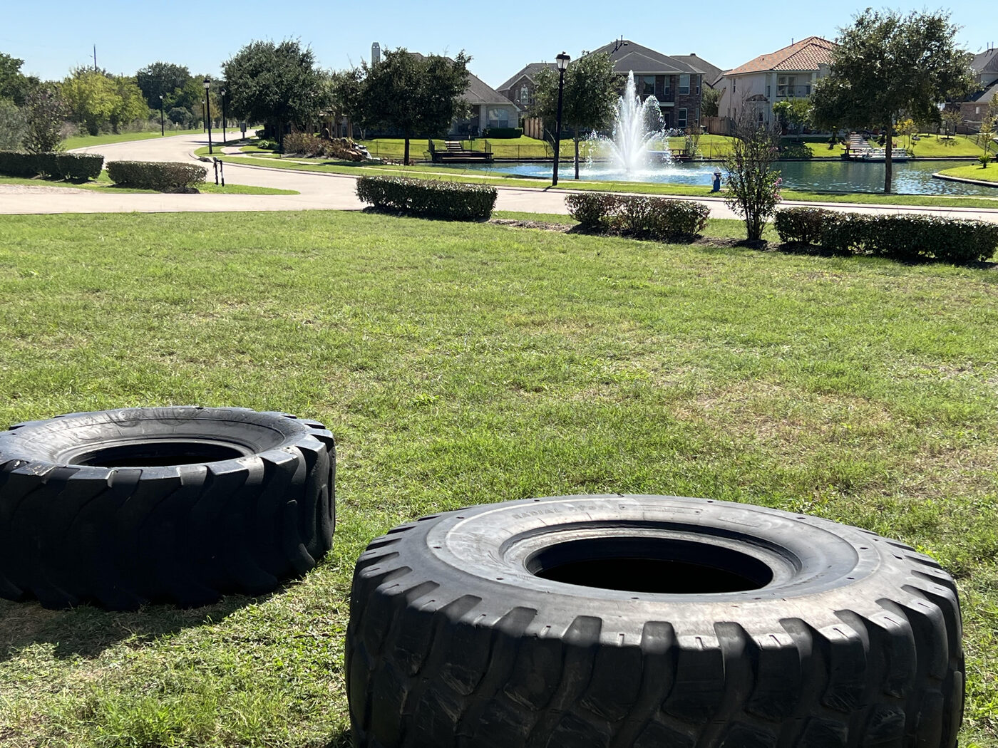 Outdoor tire-flip training area at Gym Cypress